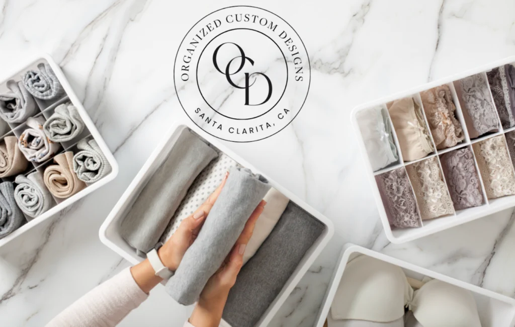 Organized Custom Designs logo on marble with folded towels